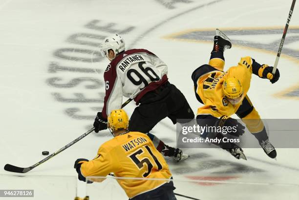 Colorado Avalanche right wing Mikko Rantanen and Nashville Predators center Colton Sissons crash into each other during play in the first period...