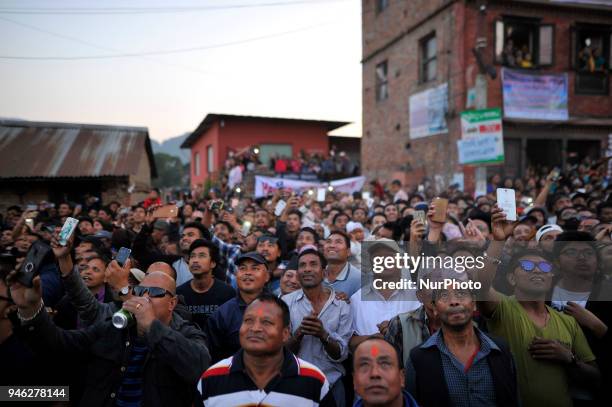 Nepalese devotees observe the pull down 'Linga' a wodden pole during the celebration of Bisket Jatra Festival at Bhaktapur, Nepal on Saturday, April...