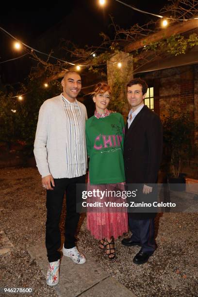 Omar Hassan, Nina Zilli, and Carlo Mazzoni attend Burberry Private Dinner Event on April 14, 2018 in Milan, Italy.