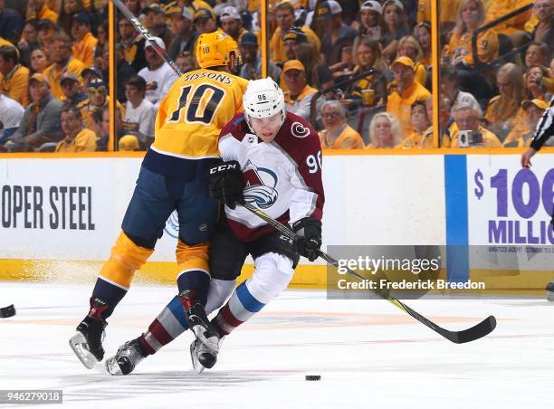 Colton Sissons of the Nashville Predators collides with Mikko Rantanen of the Colorado Avalanche during the first period in Game Two of the Western...