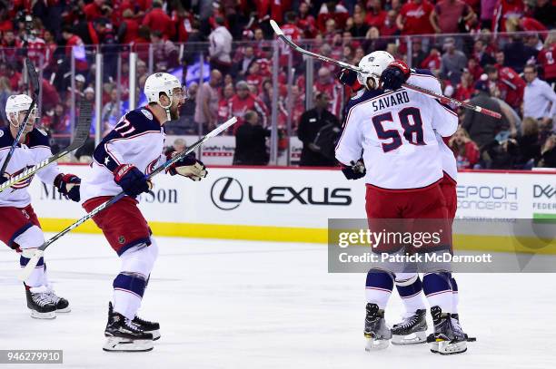 Artemi Panarin of the Columbus Blue Jackets celebrates with his teammates after scoring the game-winning goal in overtime against the Washington...