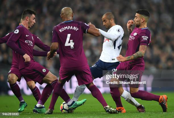 Lucas Moura of Tottenham Hotspur is fouled by Nicolas Otamendi of Manchester City, David Silva of Manchester City, Vincent Kompany of Manchester City...