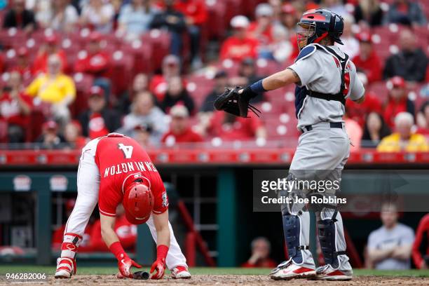 Cliff Pennington of the Cincinnati Reds reacts after striking out with the bases loaded in the ninth inning of the game against the St. Louis...