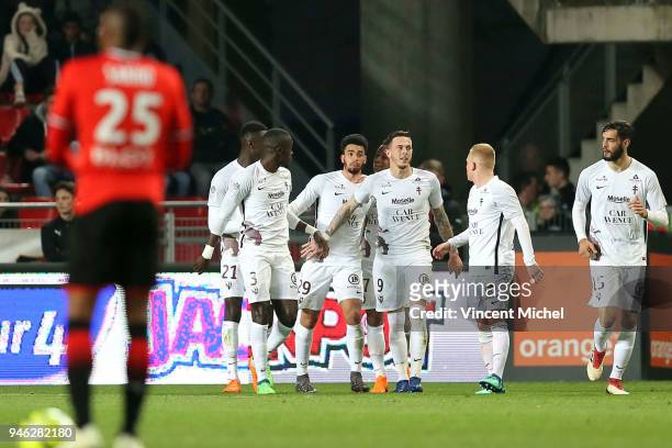 Nolan Roux of Metz celebrates with teammates after scoring the second goal during the Ligue 1 match between Rennes and Metz at Roazhon Park on April...