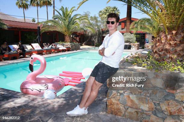 Gregg Sulkin poolside with H&M at The Sparrows Lodge on April 14, 2018 in Palm Springs, California.