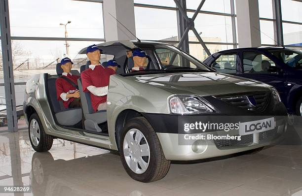 Four manequins take a test drive in the newest edition of the Dacia Logan at a dealership in Bucharest, Romania, on Friday, Feb. 23, 2007. With the...