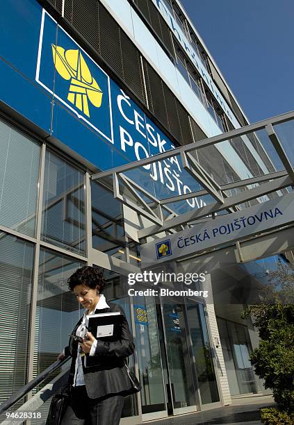 Woman exits headquarters of the Ceska Pojistovna in Prague, Czech Republic, Wednesday, April 25, 2006. Assicurazioni Generali SpA, Italy's biggest...