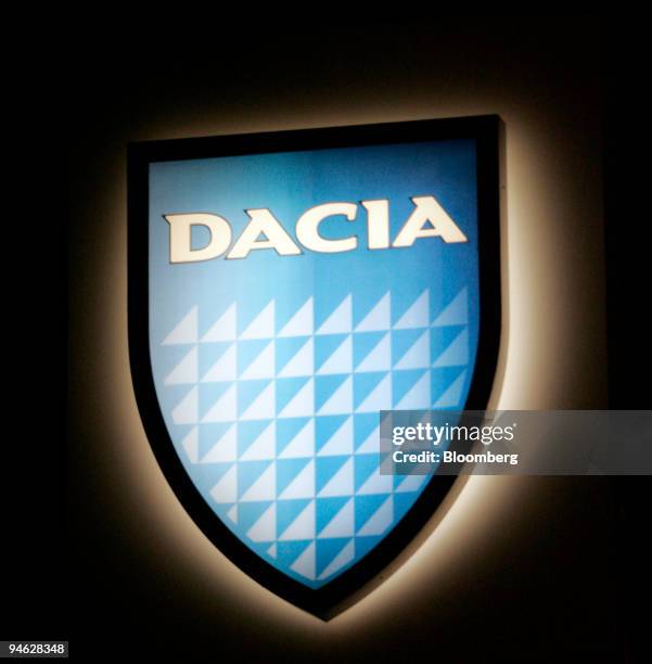 The Dacia logo is seen at a dealership in Bucharest, Romania, on Friday, Feb. 23, 2007. With the Logan, Renault set out to design an inexpensive car...