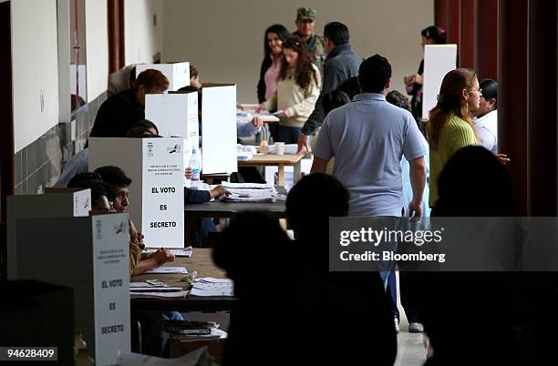 Ecuadorians take part in voting at a polling station on election day in Quito, Ecuador on Sunday, October 2006. Ecuador's largest banana exporter...