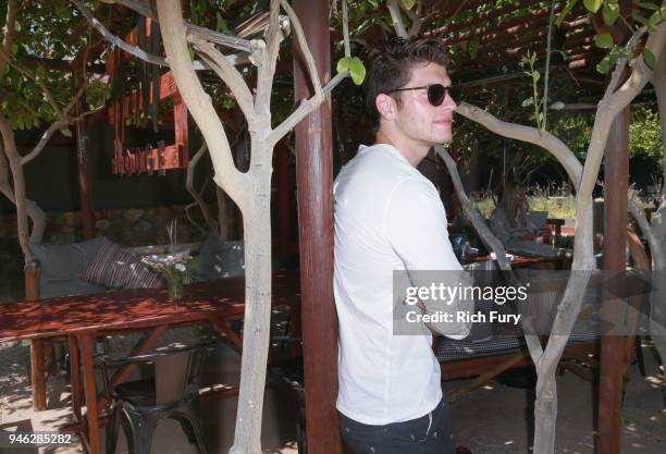 Gregg Sulkin poolside with H&M at The Sparrows Lodge on April 14, 2018 in Palm Springs, California.