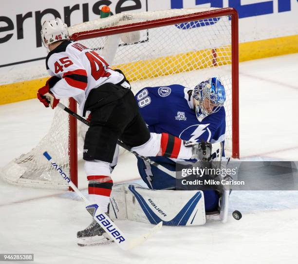 Goalie Andrei Vasilevskiy of the Tampa Bay Lightning makes a save against Sami Vatanen of the New Jersey Devils in Game Two of the Eastern Conference...