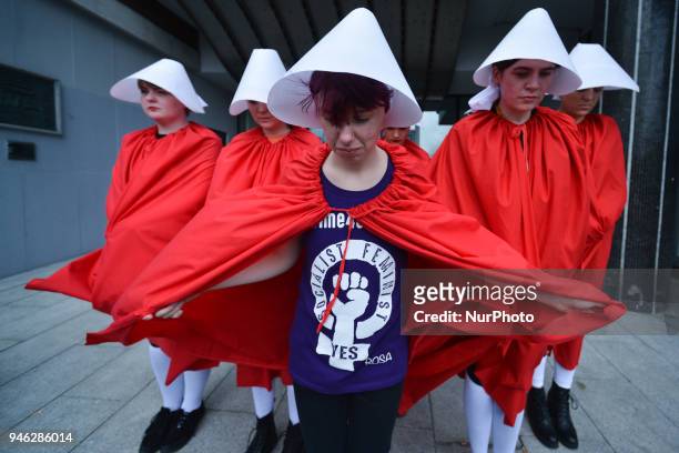Activists dressed as 'Handmaids' during a Rally for Equality, Freedom &amp; Choice organised by ROSA - an Irish Socialist Feminist Movement at...