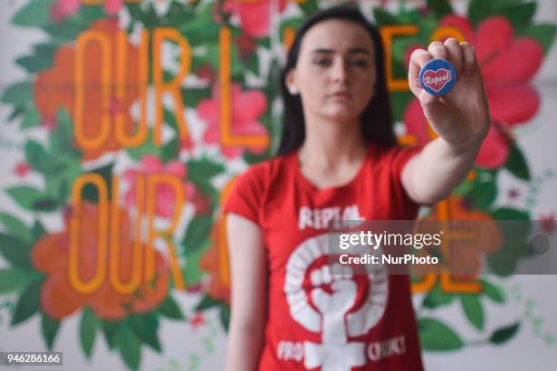 Natalya O'Flaherty, a spoken word artist and an activist holds 'Repeal' badge during a Rally for Equality, Freedom &amp; Choice organised by ROSA -...