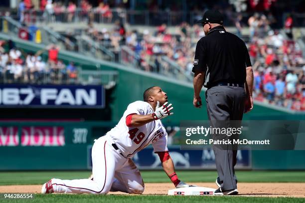 Moises Sierra of the Washington Nationals reacts after being called out stretching to third on a two-run RBI double in the sixth inning against the...