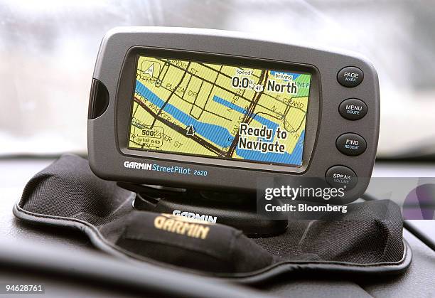 Portable Garmin Global Positioning System unit is displayed in a car in Chicago, Illinois, U.S., on Thursday, Dec. 20, 2007. Garmin Ltd. Provides...