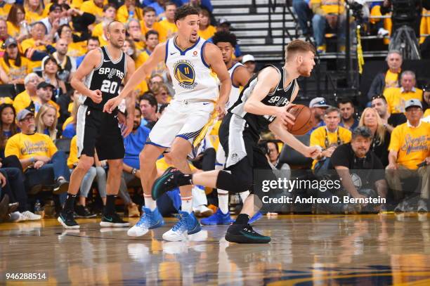 Davis Bertans of the San Antonio Spurs handles the ball against the Golden State Warriors in Game One of Round One during the 2018 NBA Playoffs on...