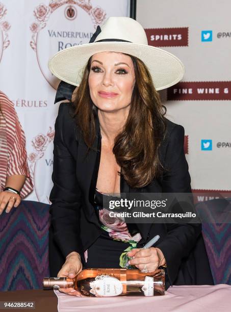 Personality Lisa Vanderpump signs bottles of Vanderpump Rose at the Fine Wine & Good Spirits Premium Collection store on April 14, 2018 in Ardmore,...