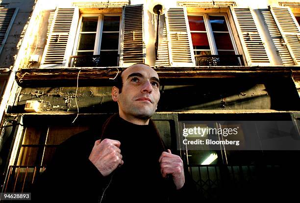 Mabrouck Rachedi, a French second-generation immigrant novelist and author of "Le Poids d'une Ame," or "The Weight of Soul," poses in Paris, France,...