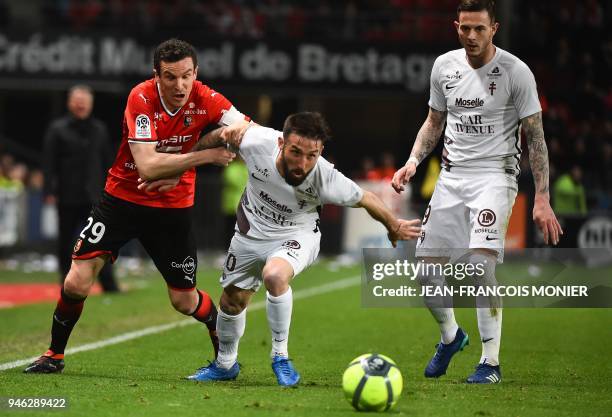 Rennes' French defender Romain Danze vies with Metz's French defender Julian Palmieri during the French L1 football match between Rennes and Metz ,...