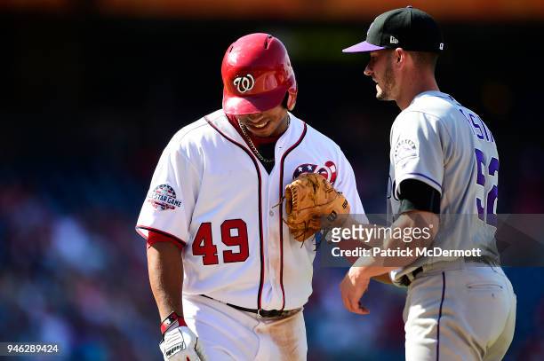 Moises Sierra of the Washington Nationals reacts as he is tagged out by Chris Rusin of the Colorado Rockies on a ground ball in the eighth inning at...