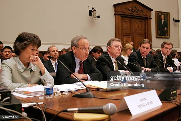 Federal Reserve Board Vice Chairman Donald Kohn, second from left, testifies at a House Financial Services Committee hearing on industrial loans,...