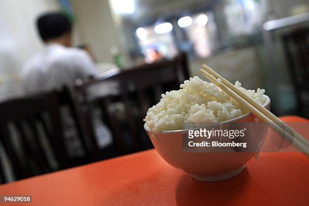 Bowl of rice lays on a table of a restaurant in Beijing, China, Monday, August 14, 2006. The world may soon pay more than ever for its most abundant...