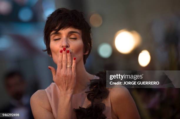 Spanish actress Paz Vega blows a kiss as she poses on the red-carpet of the 21st Malaga Spanish Film Festival on April 14, 2018 in Malaga. / AFP...