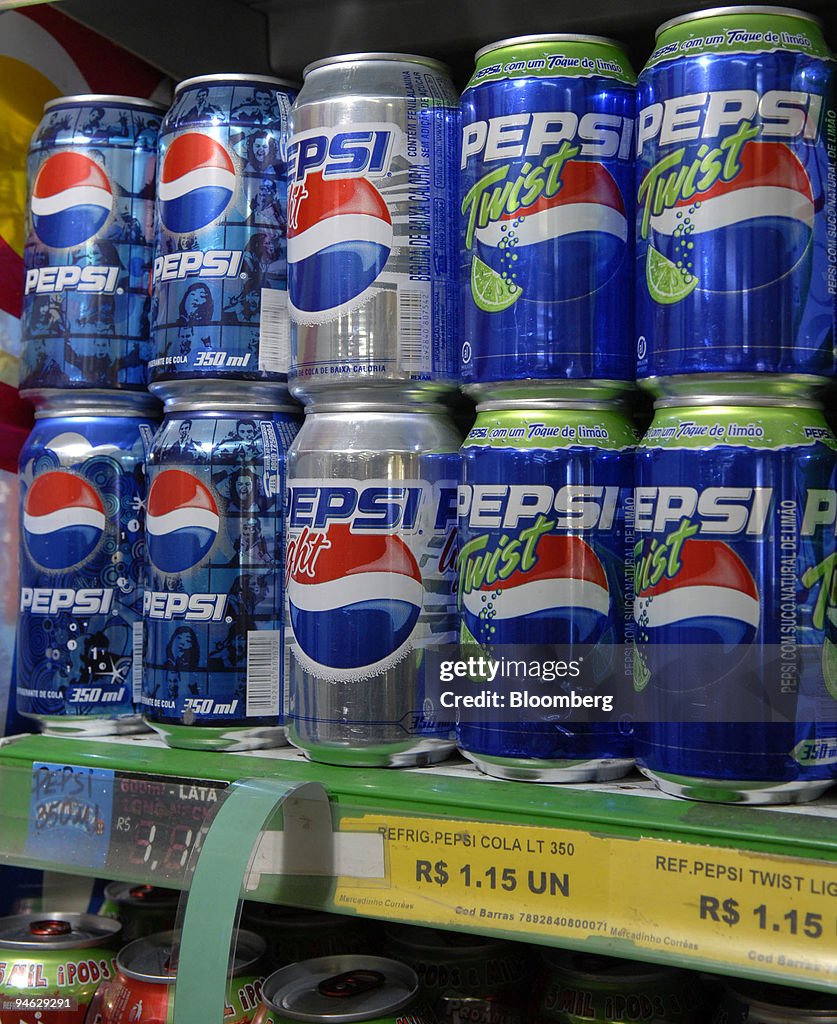 Cans of Pepsi soda products sit on shelves at a market on Ap