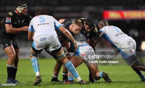 Jean-Luc du Preez of the Cell C Sharks and Ruan Botha of the Cell C Sharks tackling Pierre Schoeman of the Vodacom Blue Bulls during the Super Rugby...