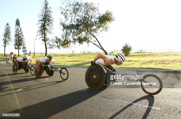 Tristan Smyth of Canada, Johnboy Smith of England and Simon Lawson of England compete during the Men's and Women's T54 marathon on day 11 of the Gold...