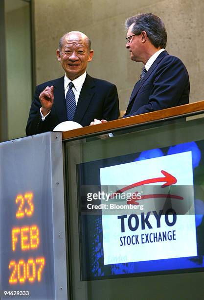 Taizo Nishimuro, president and chief executive officer of the Tokyo Stock Exchange, Inc., talks with Chris Gibson-Smith, chairman of the London Stock...