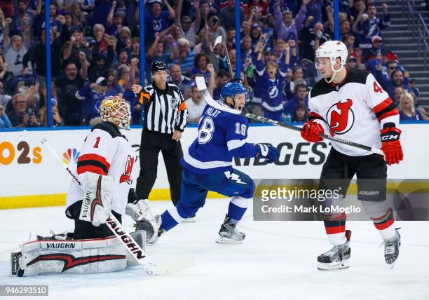 Ondrej Palat of the Tampa Bay Lightning celebrates a goal against goalie Keith Kinkaid and Sami Vatanen of the New Jersey Devils in Game Two of the...