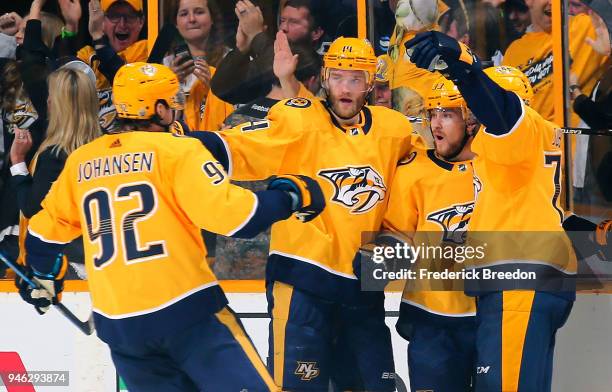 Ryan Johansen, Mattias Ekholm, and P.K. Subban of the Nashville Predators congratulate teammate Viktor Arvidsson on scoring a goal against the...