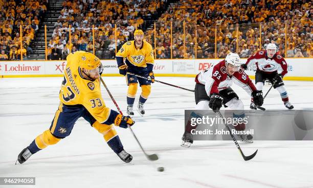 Viktor Arvidsson of the Nashville Predators scores on his shot against Matt Nieto of the Colorado Avalanche in Game Two of the Western Conference...