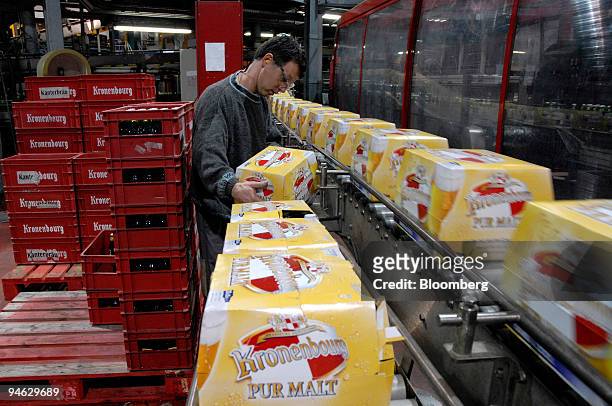 Worker prepares crates of Kronenbourg beer for transport at the company's brewery in Obernay, France, on Tuesday, Dec. 18, 2007. Carlsberg A/S Chief...