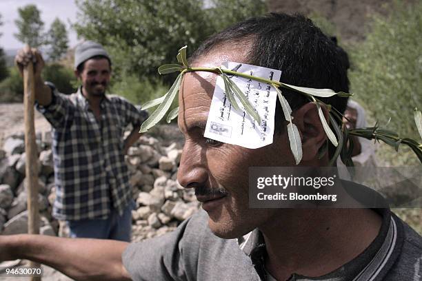 Builder shows his support for a local candidate in the village of Anfgou, near Midelt, Morocco, on Monday, August 27, 2007. Moroccans go to the polls...