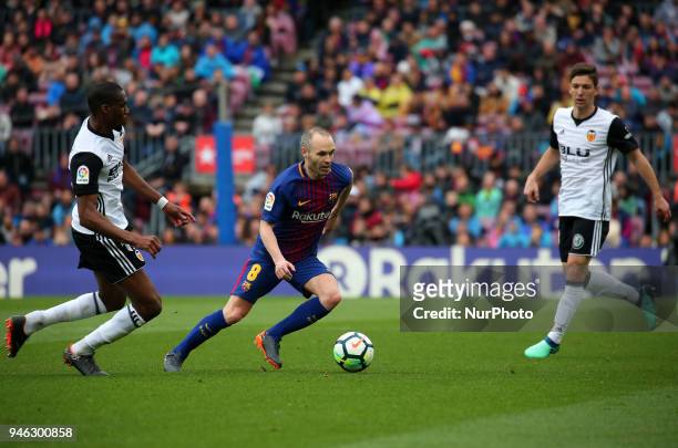 Geoffrey Kondogbia and Andres Iniesta during the match between FC Barcelona and Valencia CF, played at the Camp Nou Stadium on 14th April 2018 in...