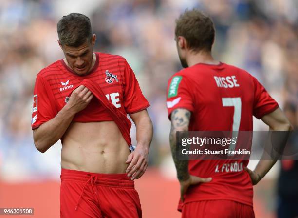 Simon Terodde and Marcel RisseÊof Cologne look dejected after the Bundesliga match between Hertha BSC and 1. FC Koeln at Olympiastadion on April 14,...