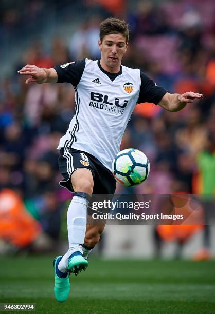 Luciano Vietto of Valencia in action during the La Liga match between Barcelona and Valencia at Camp Nou on April 14, 2018 in Barcelona, Spain.