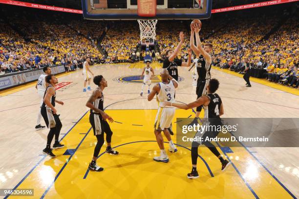 Davis Bertans of the San Antonio Spurs handles the ball against the Golden State Warriors in Game One of Round One during the 2018 NBA Playoffs on...
