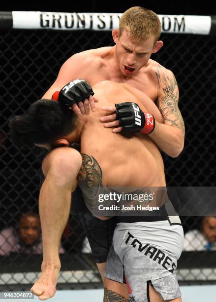 Krzysztof Jotko of Poland knrees Brad Tavares n their middleweight fight during the UFC Fight Night event at the Gila Rivera Arena on April 14, 2018...