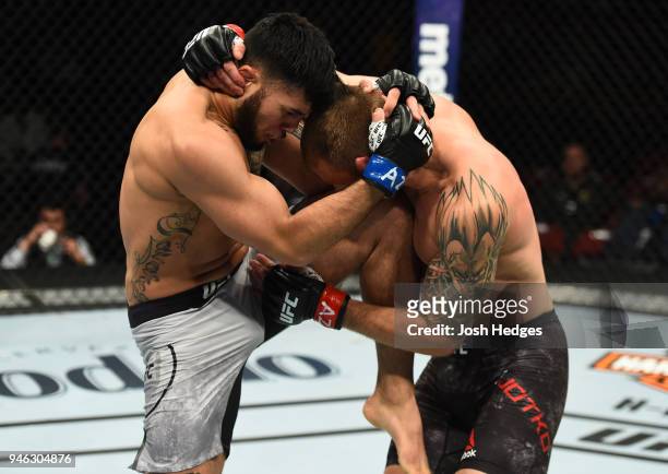Brad Tavares knees Krzysztof Jotko of Poland in their middleweight fight during the UFC Fight Night event at the Gila Rivera Arena on April 14, 2018...