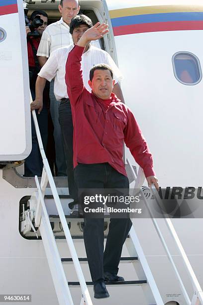 Venezuelan President Hugo Chavez arrives in Chimore, Bolivia to visit Bolivian President Evo Morales, walking behind Chavez, in the Chapare region of...