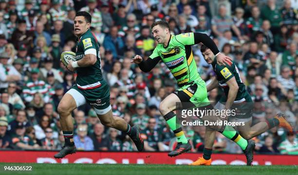 Matt Toomua of Leicester Tigers breaks clear of George North during the Aviva Premiership match between Leicester Tigers and Northampton Saints at...