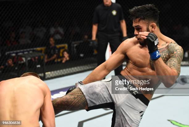 Brad Tavares kicks Krzysztof Jotko of Poland in their middleweight fight during the UFC Fight Night event at the Gila Rivera Arena on April 14, 2018...