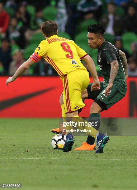 Cristian Ramirez of FC Krasnodar vies for the ball with Kirill Kombarov of FC Arsenal Tula during the Russian Premier League match between FC...