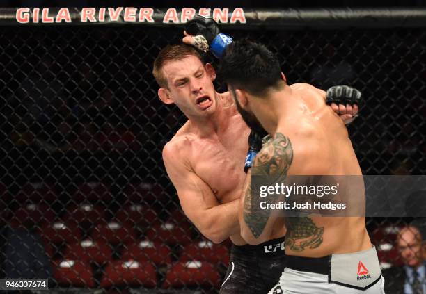 Brad Tavares punches Krzysztof Jotko of Poland in their middleweight fight during the UFC Fight Night event at the Gila Rivera Arena on April 14,...