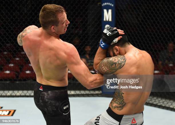 Krzysztof Jotko of Poland punches Brad Tavares n their middleweight fight during the UFC Fight Night event at the Gila Rivera Arena on April 14, 2018...