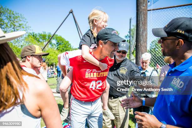 Rep. Beto O'Rourke carries his daughter Molly during a fundraiser baseball game on April 14, 2018 in Austin, Texas. O'Rourke is an El Paso Democrat...