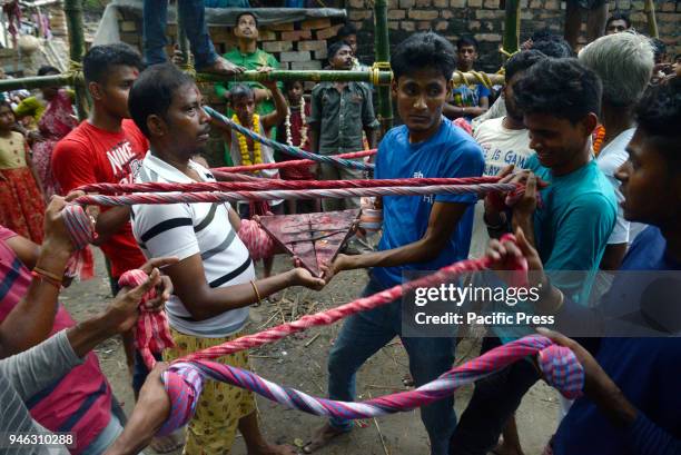 Hindu devotees prepares for holy jump given by devotees during the Charak Puja festival. Bengali observes Charak Puja on the last day of Bengali...